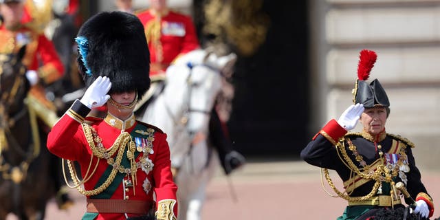 Britain's Prince William (L), Duke of Cambridge, in his role as Colonel of the Irish Guards, and Britain's Princess Anne, Princess Royal, in her role as Colonel of the Blues and Royals, salute during the Queen's Birthday Parade, the Trooping the Colour, as part of Queen Elizabeth II's Platinum Jubilee celebrations, on Horseguards Parade in London on June 2, 2022.