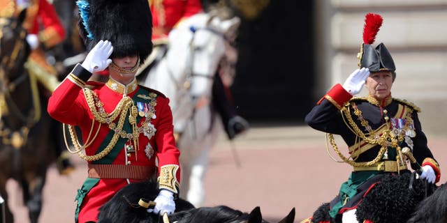 Britain's Prince William (L), Duke of Cambridge, in his role as Colonel of the Irish Guards, and Britain's Princess Anne, Princess Royal, in her role as Colonel of the Blues and Royals, salute during the Queen's Birthday Parade, the Trooping the Colour, as part of Queen Elizabeth II's Platinum Jubilee celebrations, on Horseguards Parade in London on June 2, 2022.