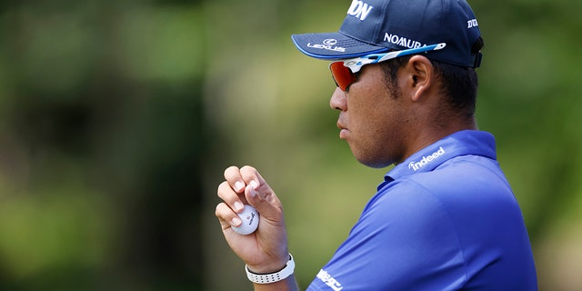 Hideki Matsuyama of Japan watches the eighth hole during the first round of the Memorial Tournament presented by Workday at Muirfield Village Golf Club on June 2, 2022 in Dublin, Ohio. 