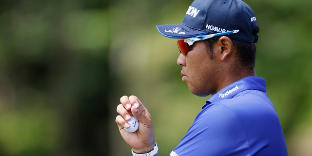 Hideki Matsuyama of Japan watches the eighth hole during the first round of the Memorial Tournament presented by Workday at Muirfield Village Golf Club on June 2, 2022, in Dublin, Ohio.