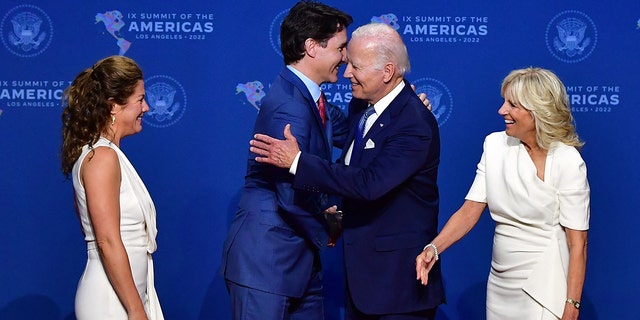 US President Joe Biden (2nd R) and First Lady Jill Biden (R) greet Canada's Prime Minister Justin Trudeau (2nd L) and his wife Sophie Gregoire Trudeau as they arrive for the 9th Summit of the Americas at the Los Angeles Convention Center in Los Angeles, California on June 8, 2022. 