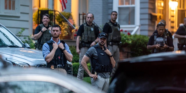 Law enforcement officers remain vigilant as protesters march past Brett Kavanaugh's home in the Supreme Court on June 8, 2022 in Chevy Chase, Maryland. 