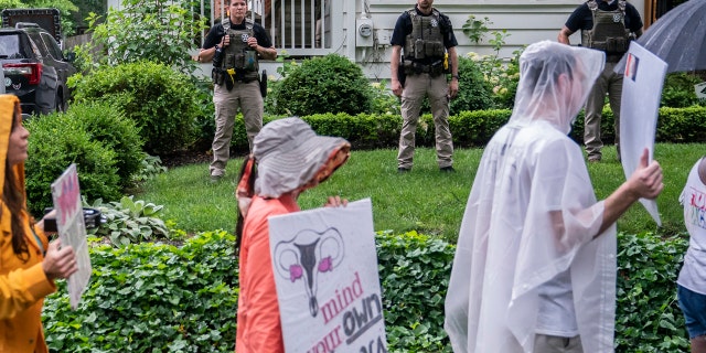 CHEVY CHASE, MD: Protesters march past Supreme Court Justice Brett Kavanaugh's home. 