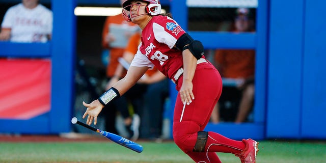Jocelyn Alo of the Sooners watches her two-run homer clear the wall against the Texas Longhorns on June 8, 2022 in Oklahoma City.