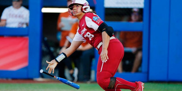 Jocelyn Alo of the Sooners watches her two-run homer clear the wall against the Texas Longhorns on June 8, 2022 in Oklahoma City.