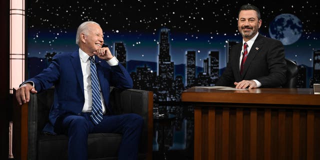 President Biden sits next host Jimmy Kimmel. (Photo by Jim WATSON / AFP) (Photo by JIM WATSON/AFP via Getty Images)