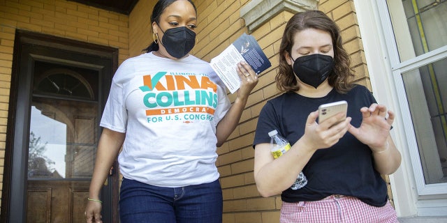 Challenger Kina Collins, left, campaigns door-to-door with her manager, Isabel Alter, on May 29, 2022, in Chicago's Galewood neighborhood. (Erin Hooley/Chicago Tribune/Tribune News Service via Getty Images)