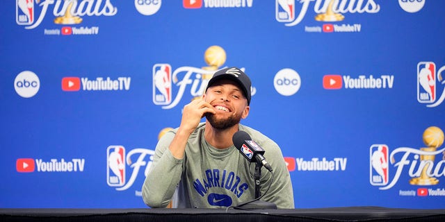 Stephen Curry of the Golden State Warriors talks to the media on June 9, 2022, at the TD Garden in Boston, Massachusetts.