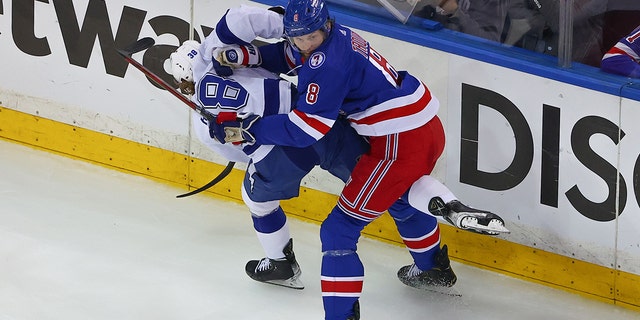 Rangers defenseman Jacob Trouba hits Tampa Bay Lightning left wing Brandon Hagel during the Eastern Conference Finals on June 9, 2022, in New York City.  