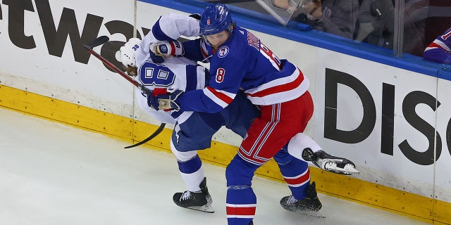 Rangers defenseman Jacob Trouba hits Tampa Bay Lightning left wing Brandon Hagel during the Eastern Conference Finals on June 9, 2022, in New York City.