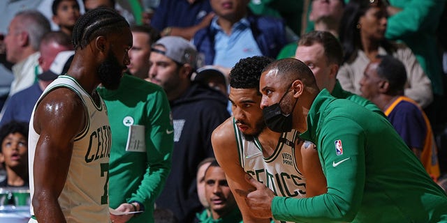 Ime Udoke coaches Jaylen Brown (7) and Jayson Tatum (0) of the Boston Celtics against the Golden State Warriors during Game 4 of the 2022 NBA Finals June 10, 2022, at TD Garden in Boston. 