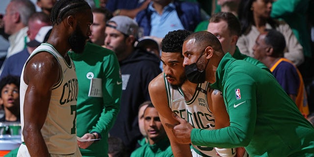 Ime Udoke coaches Jaylen Brown (7) and Jason Tatum (0) of the Boston Celtics against the Golden State Warriors during Game 4 of the 2022 NBA Finals on June 10, 2022 at TD Garden in Boston. 