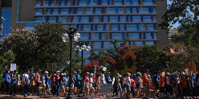 SAN ANTONIO,TX - JUNE 11: People walk during the March for Our Lives rally at Milan Park on June11, 2022 in San Antonio, Texas. 