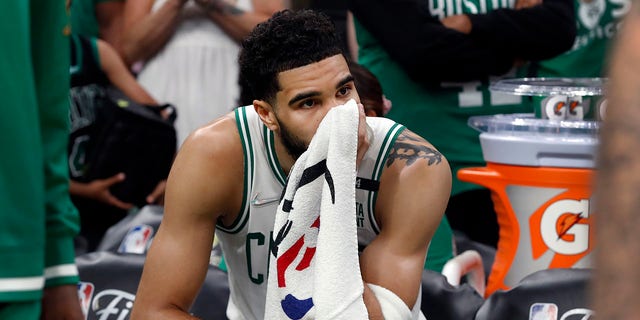 The Celtics Jayson Tatum is pictured on the bench as the final seconds tick off of the clock. The Boston Celtics hosted the Golden State Warriors for Game Six of the NBA Finals at the TD Garden in Boston on June 17, 2022. 