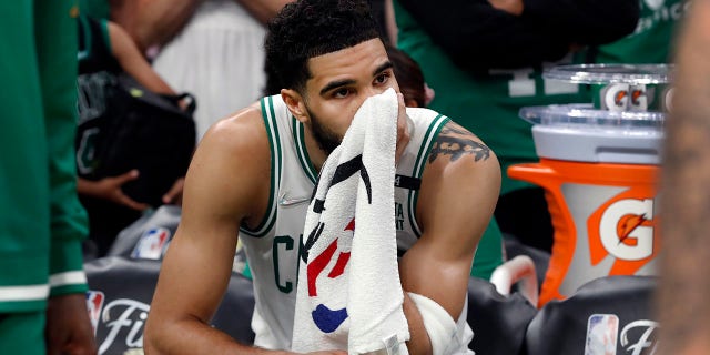 The Celtics Jayson Tatum is pictured on the bench as the final seconds tick off of the clock. The Boston Celtics hosted the Golden State Warriors for Game Six of the NBA Finals at the TD Garden in Boston on June 17, 2022.