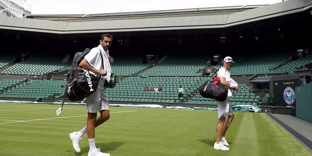 Marin Cilic leaves court after practicing on centre court ahead of the 2022 Wimbledon Championship at the All England Lawn Tennis and Croquet Club, Wimbledon. Cilic was the first player to withdraw after testing positive for COVID-19. 