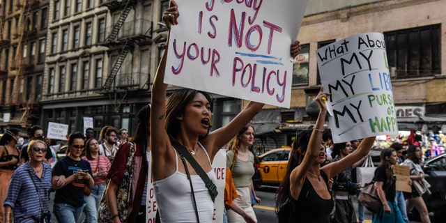Abortion rights demonstrators march during a protest in New York, US, on Friday, June 24, 2022. A deeply divided US Supreme Court overturned the 1973 Roe v. Wade decision and wiped out the constitutional right to abortion, issuing a historic ruling likely to render the procedure largely illegal in half the country. Photographer: Stephanie Keith/Bloomberg via Getty Images