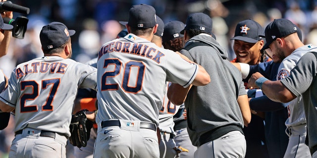 Members of the Houston Astros swarm the mound after the final out of a combined no hitter against the New York Yankees at Yankee Stadium on June 25, 2022 in the Bronx borough of New York City. The Astros defeated the Yankees 3-0. 