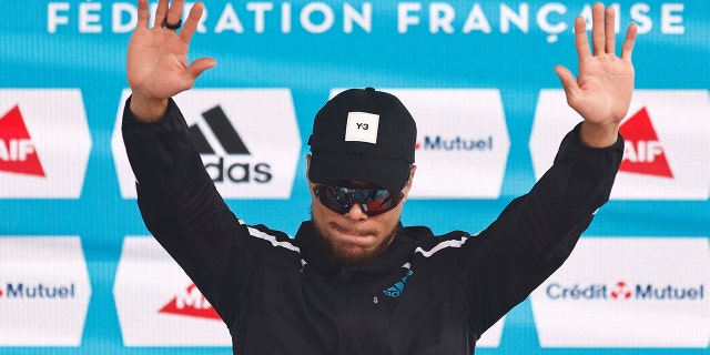 Gold medallist France's Wilfried Happio poses during podium ceremony of the mens 400 metre hurdles during the French Elite Athletics Championships at the Helitas stadium in Caen, northern France, on June 26, 2022.