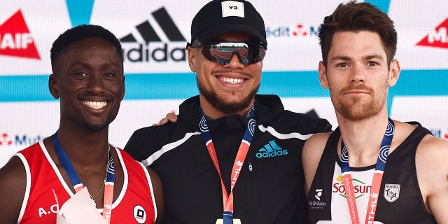 (From L/R) Silver medallist France's Ludvy Vaillant, gold medallist France's Wilfried Happio and bronze medallist France's Victor Coroller pose during podium ceremony of the mens 400 metre hurdles during the French Elite Athletics Championships at the Helitas stadium in Caen, northern France, on June 26, 2022.