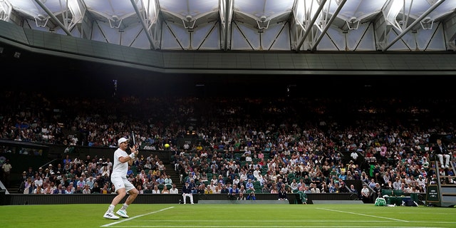 Andy Murray in action against James Duckworth during the Wimbledon Championships at the All England Lawn Tennis and Croquet Club on Monday, June 27, 2022.
