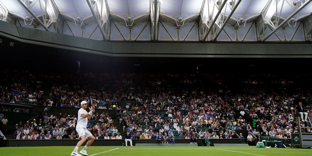 Andy Murray in action against James Duckworth during the Wimbledon Championships at the All England Lawn Tennis and Croquet Club on Monday, June 27, 2022.