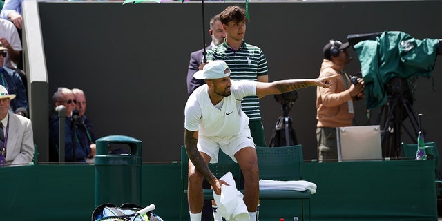 Nick Kyrgios makes a gesture during a match against Paul Jub at the All England Lawn Tennis and Croquette Club in Wimbledon.