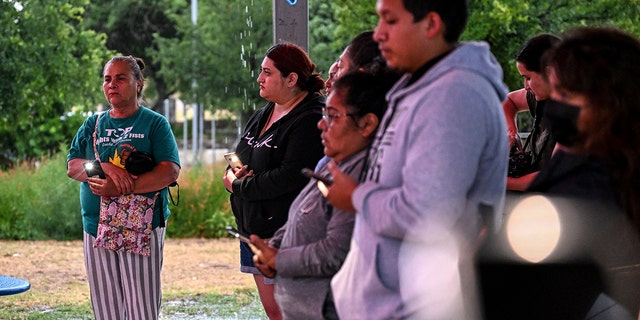 People attend a vigil for the victims found in an abandoned truck in San Antonio, Texas, on June 28, 2022. 