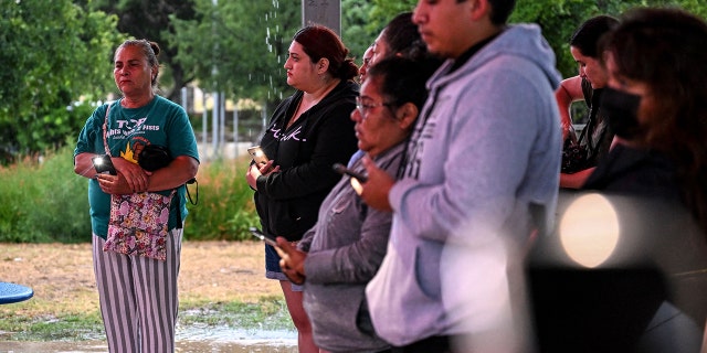 People attend a vigil for the victims found in an abandoned truck in San Antonio, Texas, on June 28, 2022.