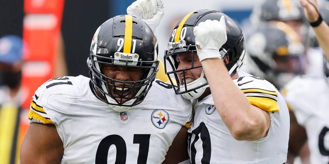 Stephon Tuitt (91) and T.J. Watt (90) of the Pittsburgh Steelers celebrate a sack against the Jacksonville Jaguars at TIAA Bank Field Nov. 22, 2020, in Jacksonville, Fla. 