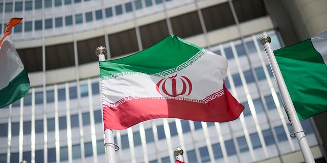 VIENNA, AUSTRIA - MAY 24: The Iranian flag is seen in front of the International Atomic Energy Agency (IAEA) headquarters building.  (Photo by Michael Gruber/Getty Images)