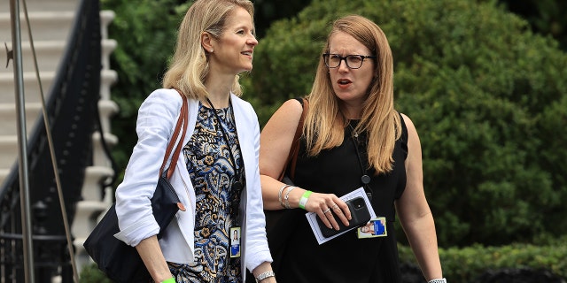 White House Counsel Dana Remus (L) and Deputy Chief of Staff Jennifer O'Malley Dillon depart the White House on July 13, 2021, in Washington, DC.