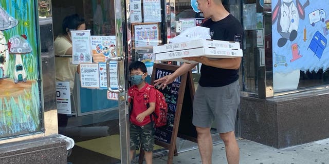 A father who dropped his son at the Daycare for Pizza Party in Queens, New York.