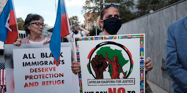 Haitian community leaders, immigrant community members, and their supporters gather at the Newark Immigration and Customs Enforcement field office to demand that President Biden's administration stop deportations and restore the right to asylum on October 22, 2021, in Newark, New Jersey.