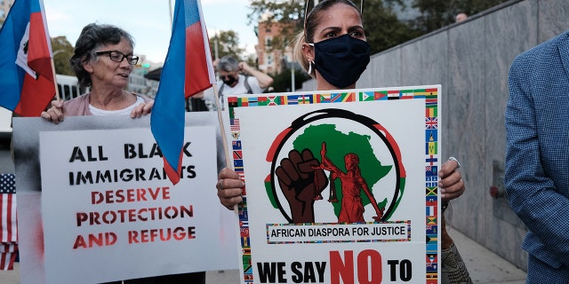 Haitian community leaders, immigrant community members, and their supporters gather at the Newark Immigration and Customs Enforcement field office to demand that President Biden's administration stop deportations and restore the right to asylum on October 22, 2021, in Newark, New Jersey.