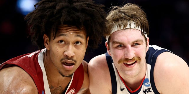 Jaylin Williams of the Arkansas Razorbacks and Drew Timme of the Gonzaga Bulldogs during the Sweet 16 round game of the NCAA Men's Basketball Tournament at Chase Center on March 24, 2022, in San Francisco, California.