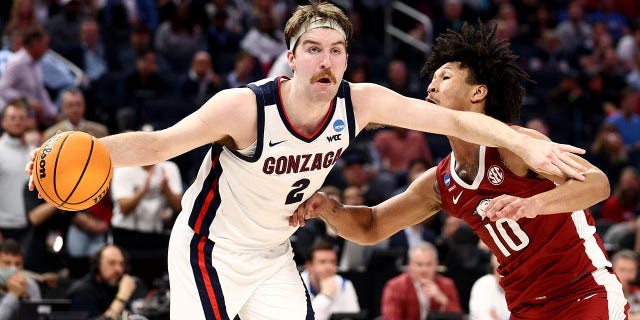 Drew Timme of the Gonzaga Bulldogs defends the ball against Jaylin Williams of the Arkansas Razorbacks at Chase Center on March 24, 2022, in San Francisco. 