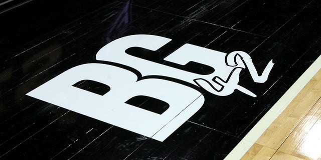 A floor decal on the sideline features the initials of Phoenix Mercury player Brittney Griner and her jersey number 42 before a game between the Seattle Storm and the Las Vegas Aces at Michelob ULTRA Arena May 8, 2022, in Las Vegas.