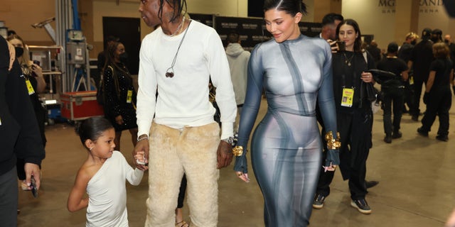 Kylie Jenner, Stormi Webster and Travis Scott backstage during the 2022 Billboard Music Awards held on May 15.