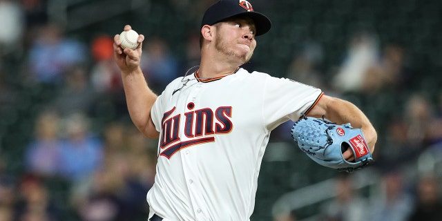 Emilio Pagan #12 of the Minnesota Twins delivers a pitch against the Oakland Athletics in the ninth inning of the game at Target Field on May 6, 2022 in Minneapolis, Minnesota. The Twins defeated the Athletics 2-1. 