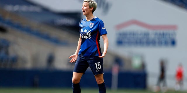 Megan Rapinoe #15 of OL Reign looks on against the Washington Spirit during the second half at Lumen Field on May 22, 2022 in Seattle, Washington.