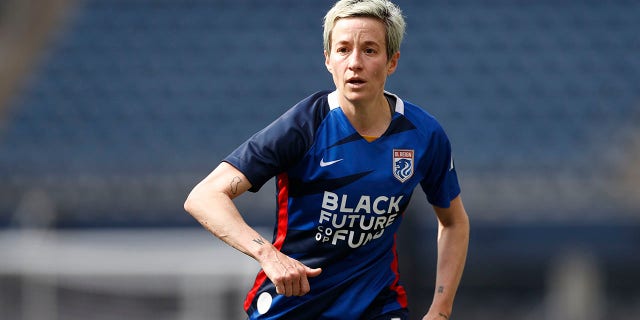 Megan Rapinoe #15 of OL Reign looks on against the Washington Spirit during the second half at Lumen Field on May 22, 2022 in Seattle, Washington.