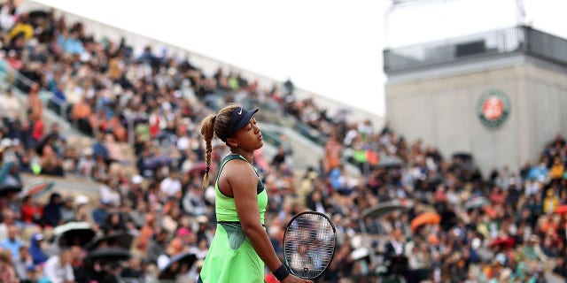 Naomi Osaka of Japan reacts against Amanda Anisimova of USA during the Women's Singles First Round match on Day 2 of The 2022 French Open at Roland Garros on May 23, 2022 in Paris. 