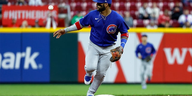CINCINNATI, OH - MAY 23: Jonathan Villar #24 of the Chicago Cubs flips the ball to a teammate after making a play at second base and ending the inning during the game against the Cincinnati Reds at Great American Ball Park on May 23, 2022 in Cincinnati, Ohio. Chicago defeated Cincinnati 7-4.