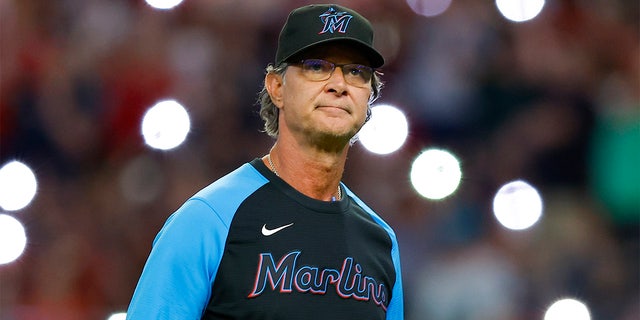 Miami Marlins manager Don Mattingly returns to the dugout after a pitching change during the seventh inning against the Atlanta Braves at Truist Park on May 27, 2022 in Atlanta, Georgia. 