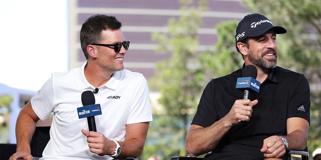 Tom Brady and Aaron Rodgers take part in the Bleacher Report Hot Seat press conference prior to Capital One's The Match VI — Brady and Rodgers v. Allen and Mahomes at Wynn Golf Club June 1, 2022, in Las Vegas.