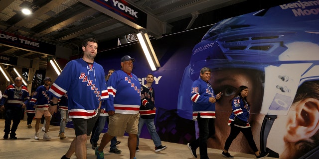 New York Rangers fans walk in the field before Game 1 between the Tampa Bay Lightning and New York Rangers in the Eastern Conference Finals of the 2022 Stanley Cup Playoffs at Madison Square Garden on June 1, 2022 in New York City. 