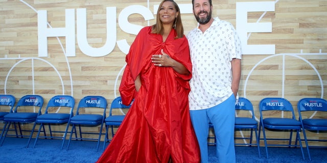 Queen Latifah co-stars in Netflix's "Hustle" alongside Adam Sandler. The two attend the Los Angeles premiere in early June.