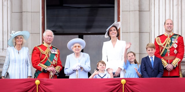 Queen Elizabeth II smiles on the balcony of Buckingham Palace during Trooping the Colour alongside (L-R) Camilla, Duchess of Cornwall, Prince Charles, Prince of Wales, Prince Louis of Cambridge, Catherine, Duchess of Cambridge and Prince Charlotte of Cambridge, Prince George and Prince William