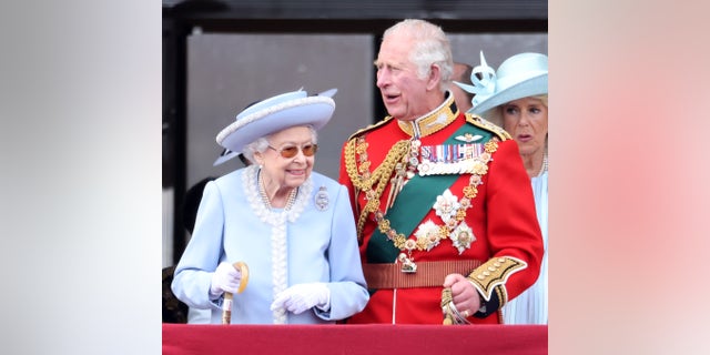 Queen Elizabeth II and Prince Charles, Prince of Wales on the balcony of Buckingham Palace during Trooping The Colour on June 02, 2022, in London, England. 